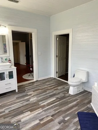 a view of a bedroom and a bathroom