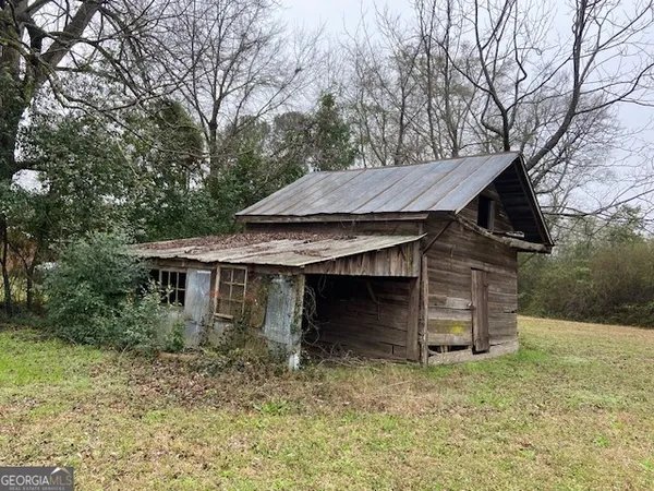 a view of a house with a tub and trees