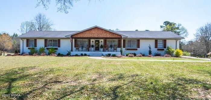 1397 Juliette Road Forsyth, GA 31029 - Photo 1 of 46 a view of a house with swimming pool yard and porch