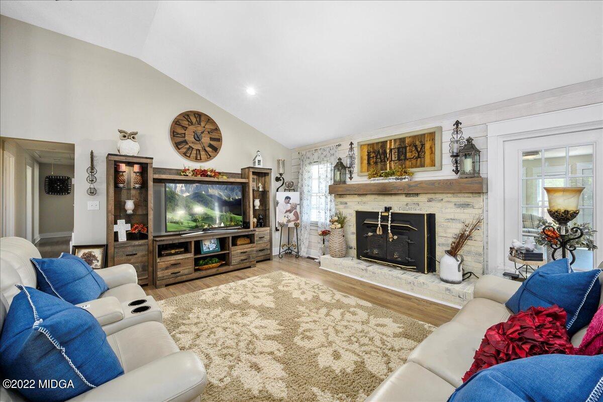 1397 Juliette Road Forsyth, GA 31029 - Photo 18 of 46 a living room with furniture and a flat screen tv