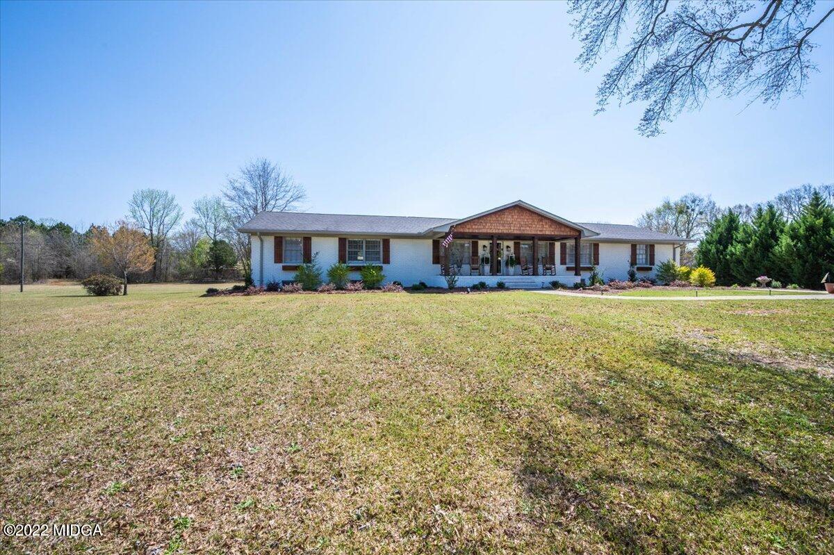 1397 Juliette Road Forsyth, GA 31029 - Photo 3 of 46 a view of a house with a yard and a garden