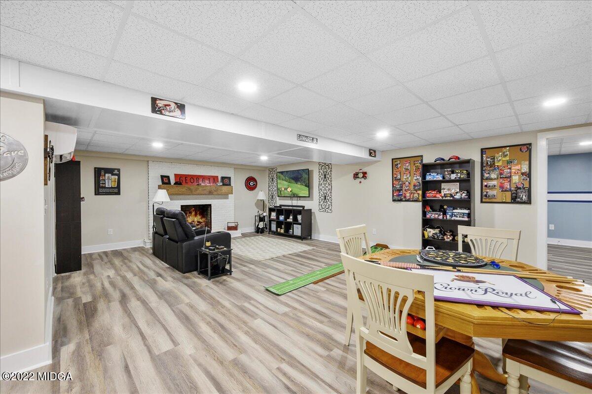 1397 Juliette Road Forsyth, GA 31029 - Photo 42 of 46 a living room with furniture and a flat screen tv