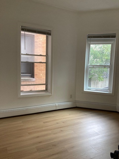 675 Washington Street, Unit 1 Brookline, MA 02446 - Photo 8 of 16 an empty room with a window