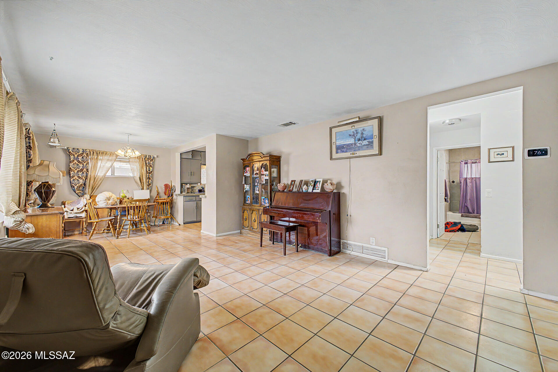 1172 East Allen Road Tucson, AZ 85719 - Photo 9 of 25 a living room with furniture and a dining table