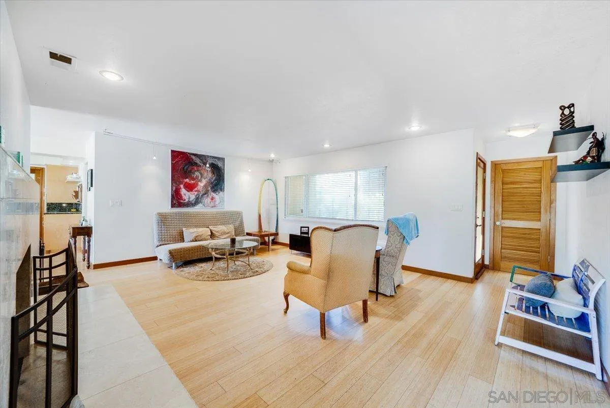 1386 Lake Drive Encinitas, CA 92024 - Photo 11 of 60 a living room with furniture and a wooden floor