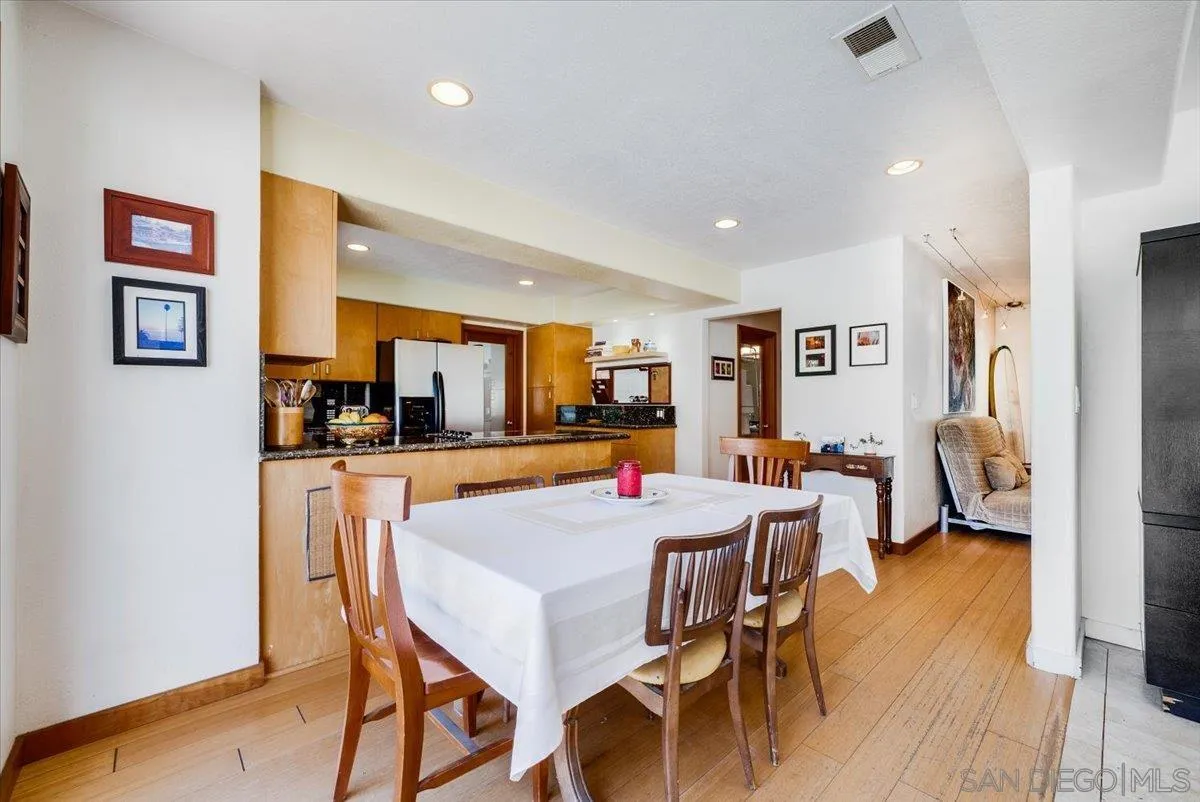 1386 Lake Drive Encinitas, CA 92024 - Photo 17 of 60 a view of a dining room with furniture and wooden floor