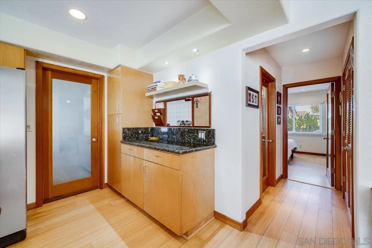 1386 Lake Drive Encinitas, CA 92024 - Photo 19 of 60 a kitchen with stainless steel appliances granite countertop a refrigerator and a stove