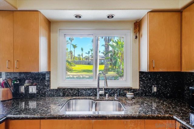 a bed sitting in a room next to a window