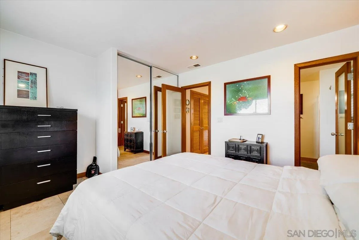 1386 Lake Drive Encinitas, CA 92024 - Photo 24 of 60 a bedroom with a bed and a dresser