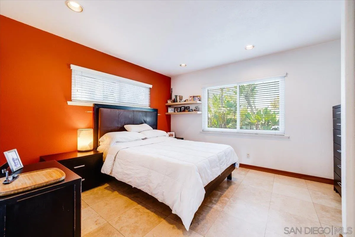 1386 Lake Drive Encinitas, CA 92024 - Photo 25 of 60 a bed sitting in a room next to a window