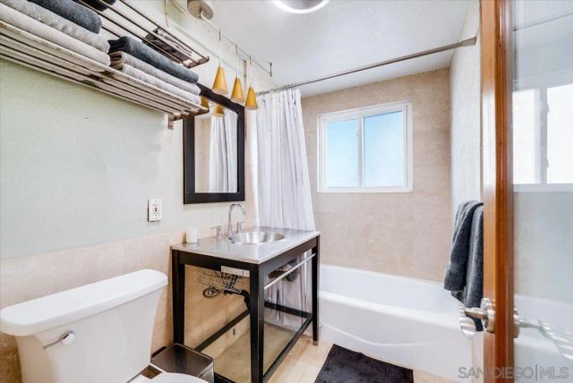 a kitchen with sink and window