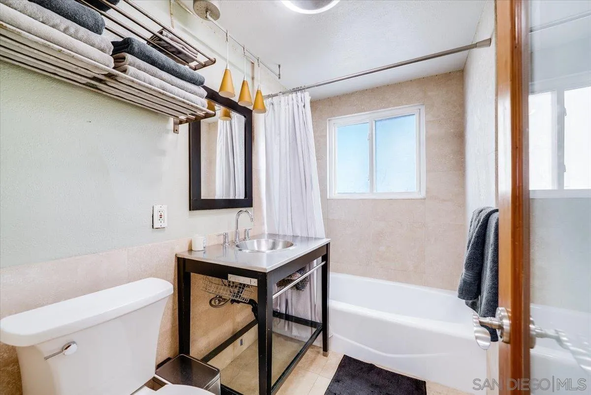 1386 Lake Drive Encinitas, CA 92024 - Photo 31 of 60 a bathroom with a sink toilet and shower