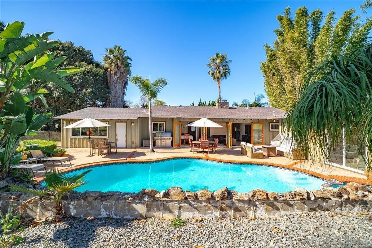 1386 Lake Drive Encinitas, CA 92024 - Photo 41 of 60 a view of a house with swimming pool and sitting area