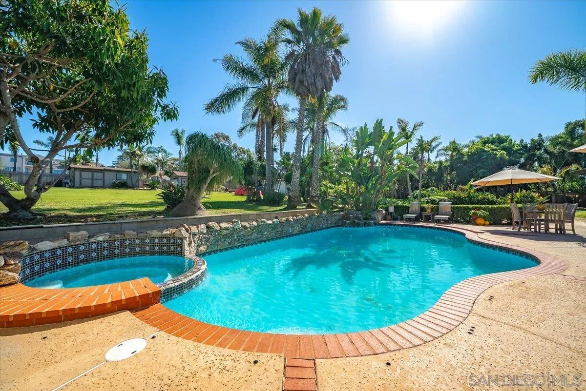 1386 Lake Drive Encinitas, CA 92024 - Photo 43 of 60 a view of a swimming pool with an outdoor space and seating area