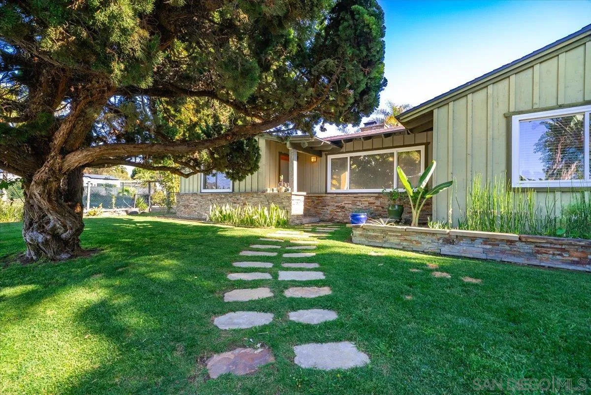 1386 Lake Drive Encinitas, CA 92024 - Photo 8 of 60 a front view of a house with garden