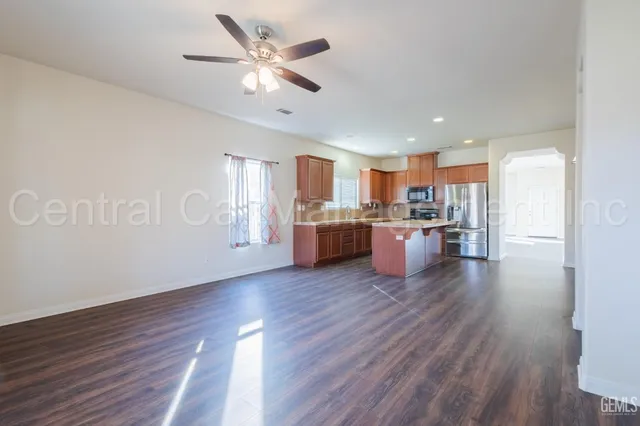 a view of kitchen with cabinets and wooden floor