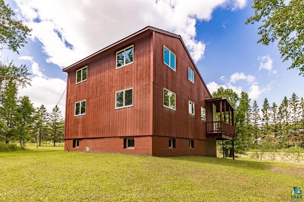 740 Seboe Road Wrenshall, MN 55797 - Photo 5 of 20 View of side of home with a balcony and a yard