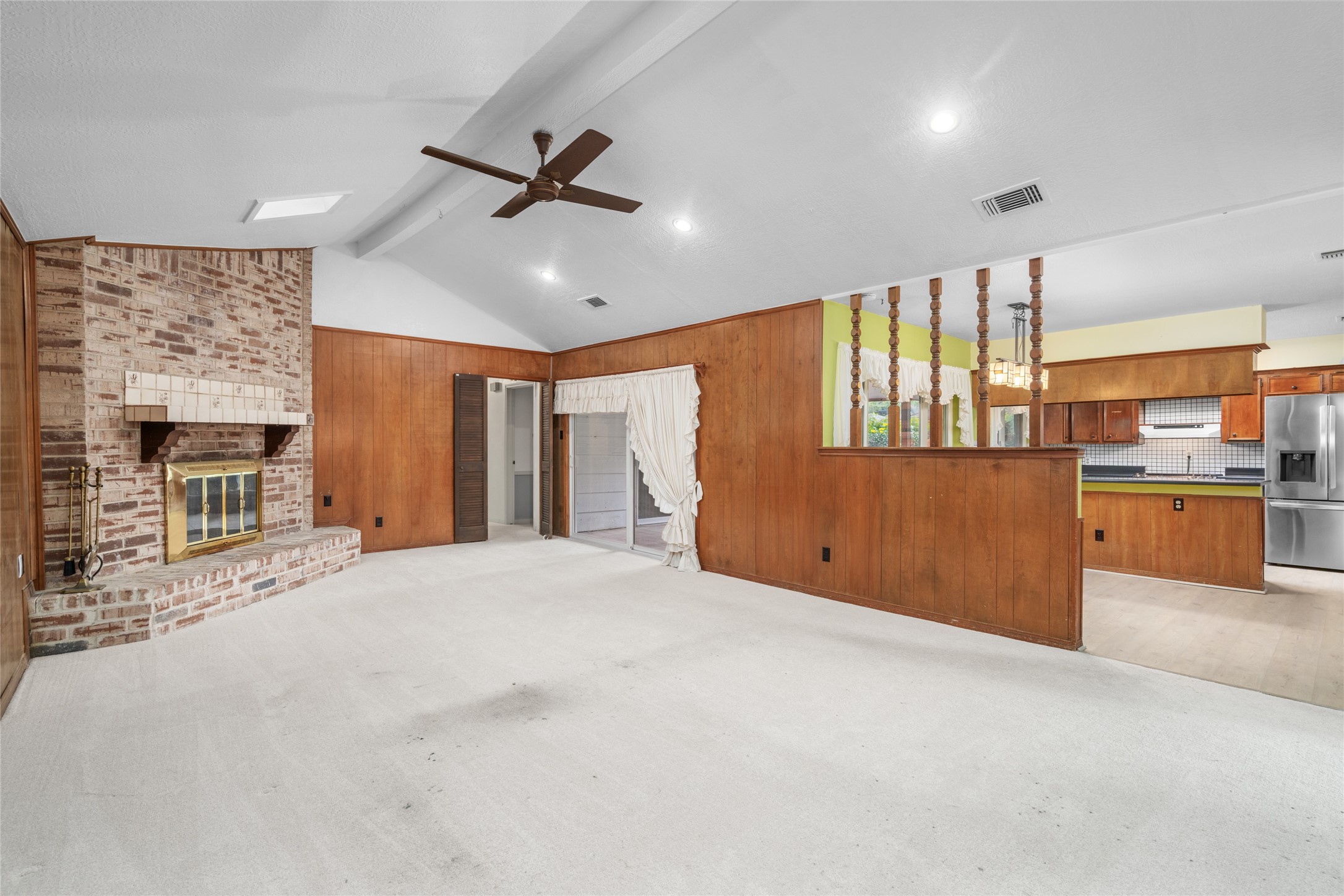 7015 Rosebrook Circle Spring, TX 77379 - Photo 2 of 15 Soaring vaulted ceilings and skylights! Your spacious main living room features a classic brick fireplace.