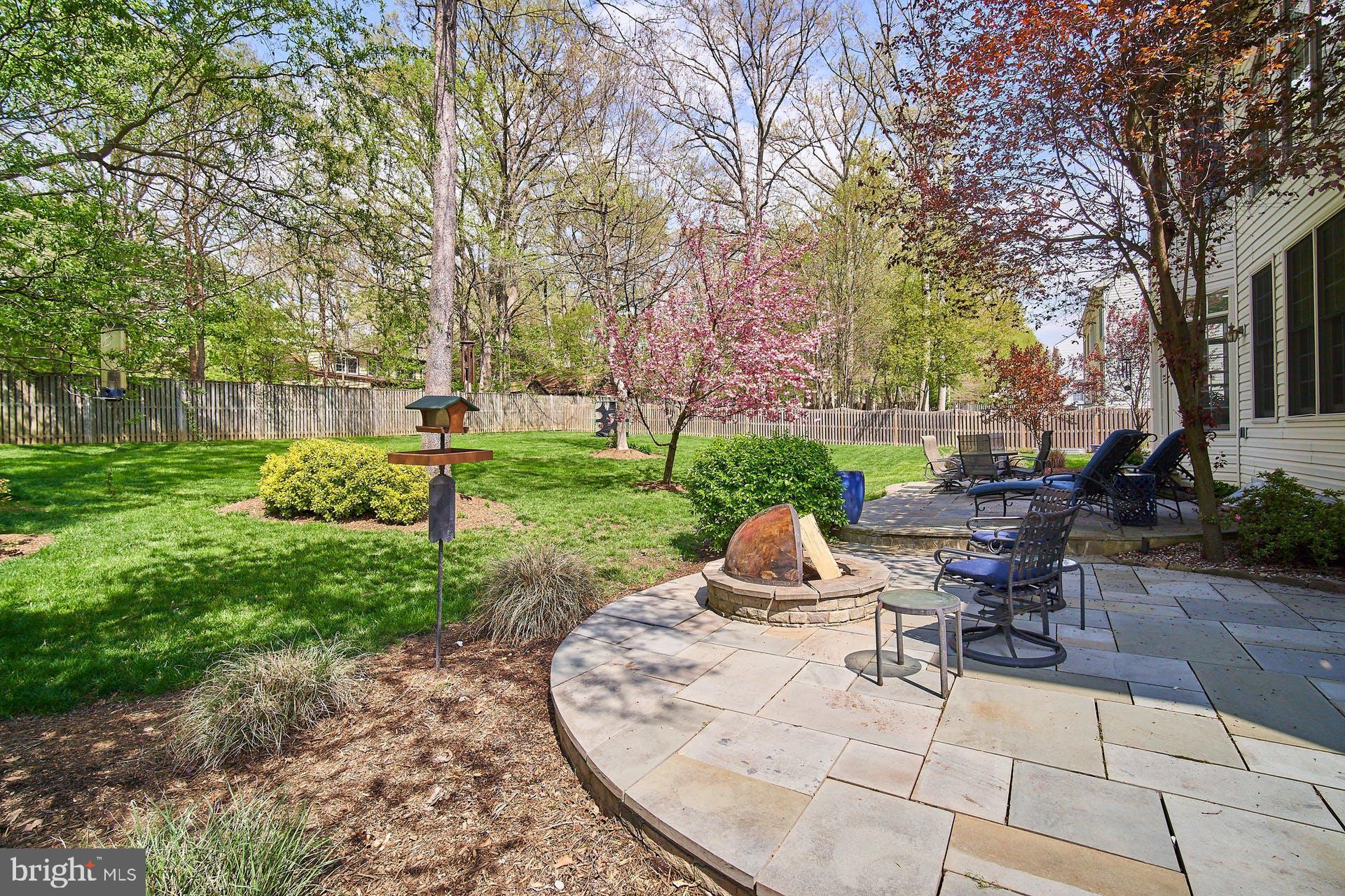7436 Spring Summit Road Springfield, VA 22150 - Photo 43 of 46 Slate patio with a built in slate fire-pit