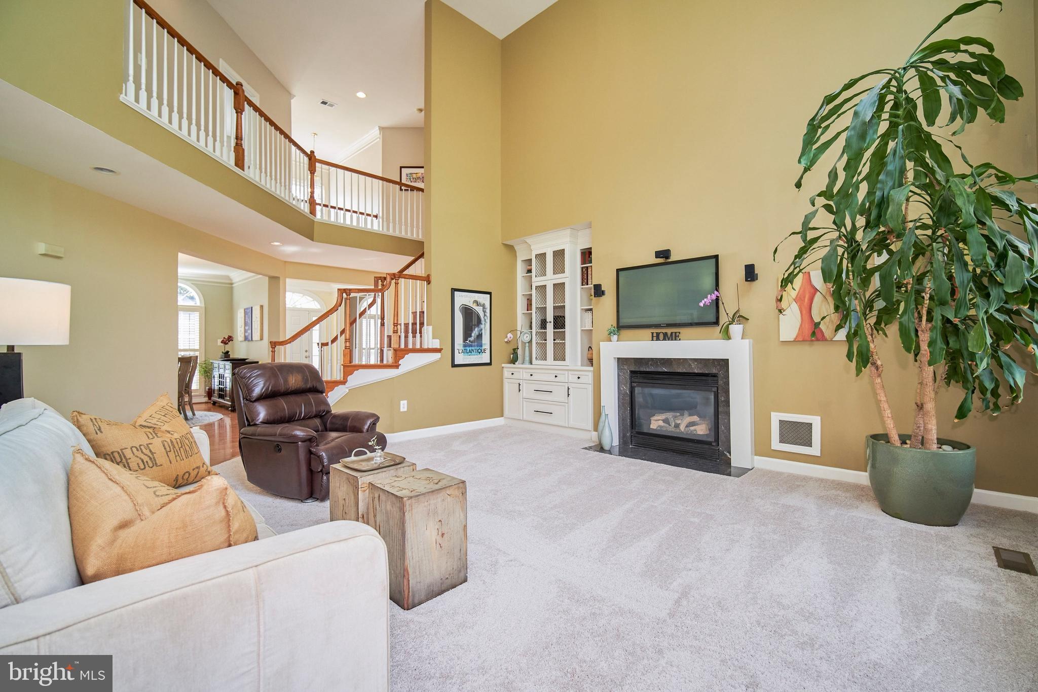 7436 Spring Summit Road Springfield, VA 22150 - Photo 8 of 46 Gas fireplace is the centerpiece in the great room