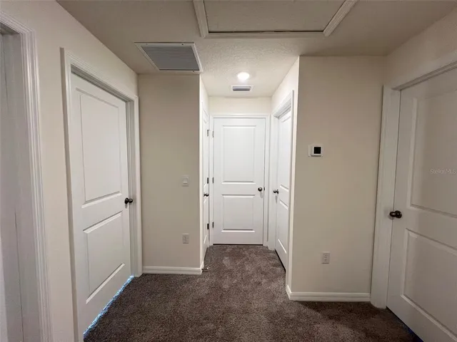 a view of a hallway with closet area