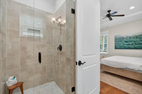 a bedroom with a large bed and a window