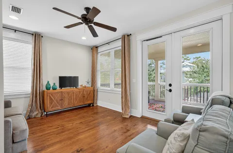 a bathroom with a granite countertop double vanity sink toilet tub and shower