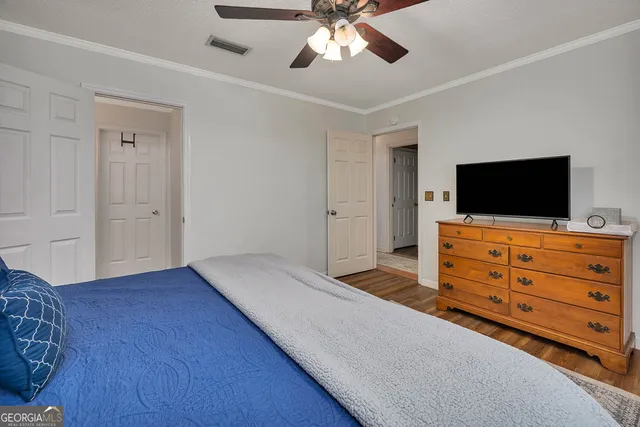 a living room with furniture and flat screen tv