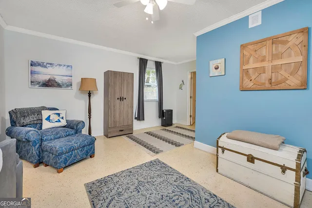 a living room with furniture and a rug