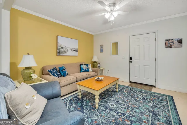 a living room with a rug and a table