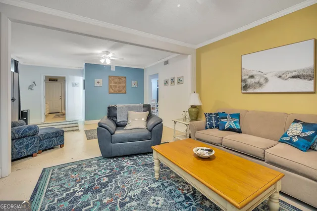 a living room with furniture and a rug