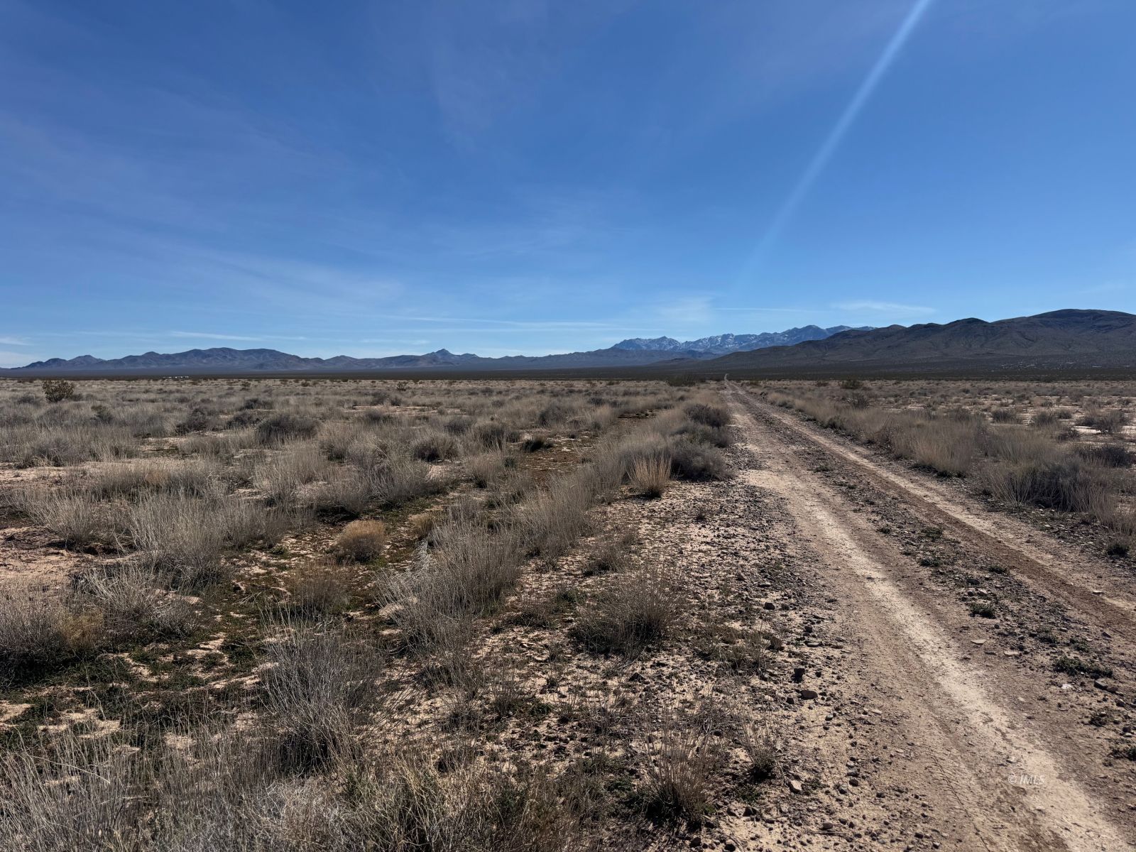 Deming Way Spring Valley Tecopa, CA 92389 - Photo 7 of 9 a view of a dry yard with wooden floor and mountain view