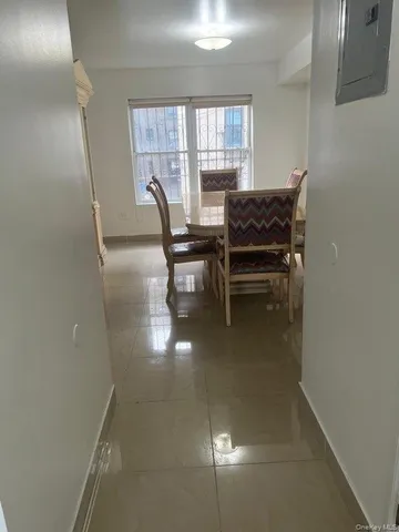 a view of a dining room with furniture and window