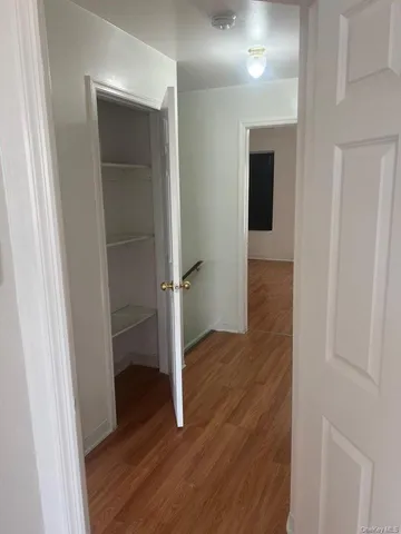 an empty room with wooden floor