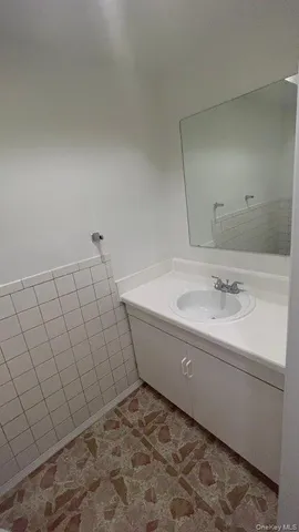 a bathroom with a bathtub and sink