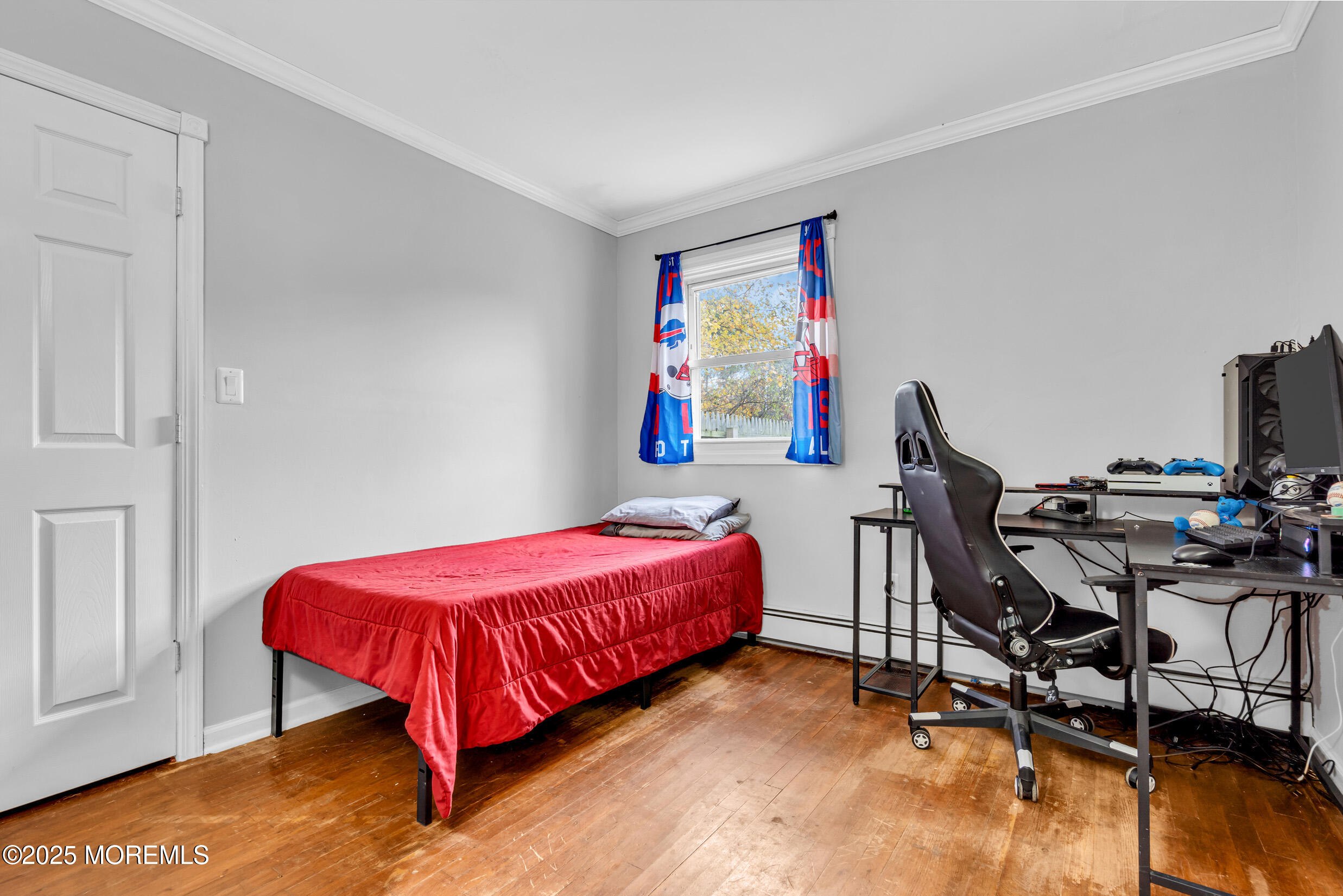 1541 Commonwealth Boulevard Toms River, NJ 08757 - Photo 21 of 34 a bed room with a bed and a chair