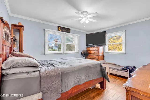 a bedroom with bed and window