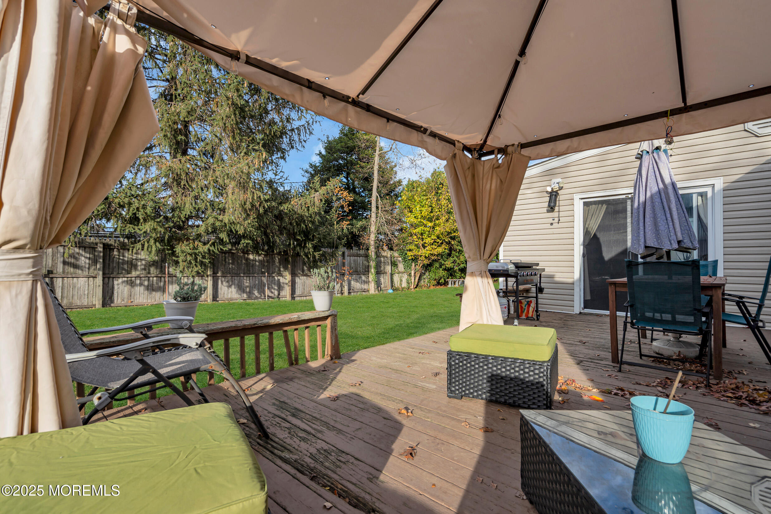 1541 Commonwealth Boulevard Toms River, NJ 08757 - Photo 25 of 34 a view of a patio with couches chairs potted plants and a big yard