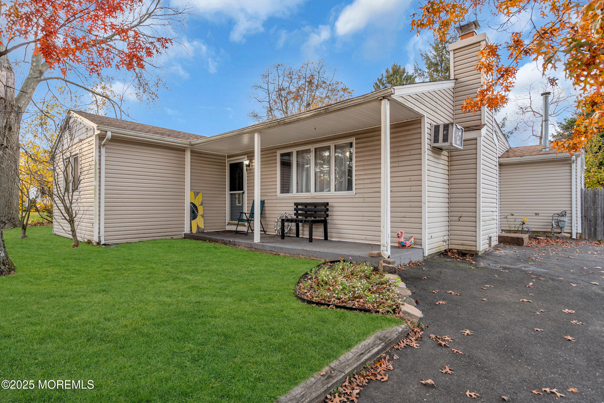 1541 Commonwealth Boulevard Toms River, NJ 08757 - Photo 3 of 34 a front view of a house with garden