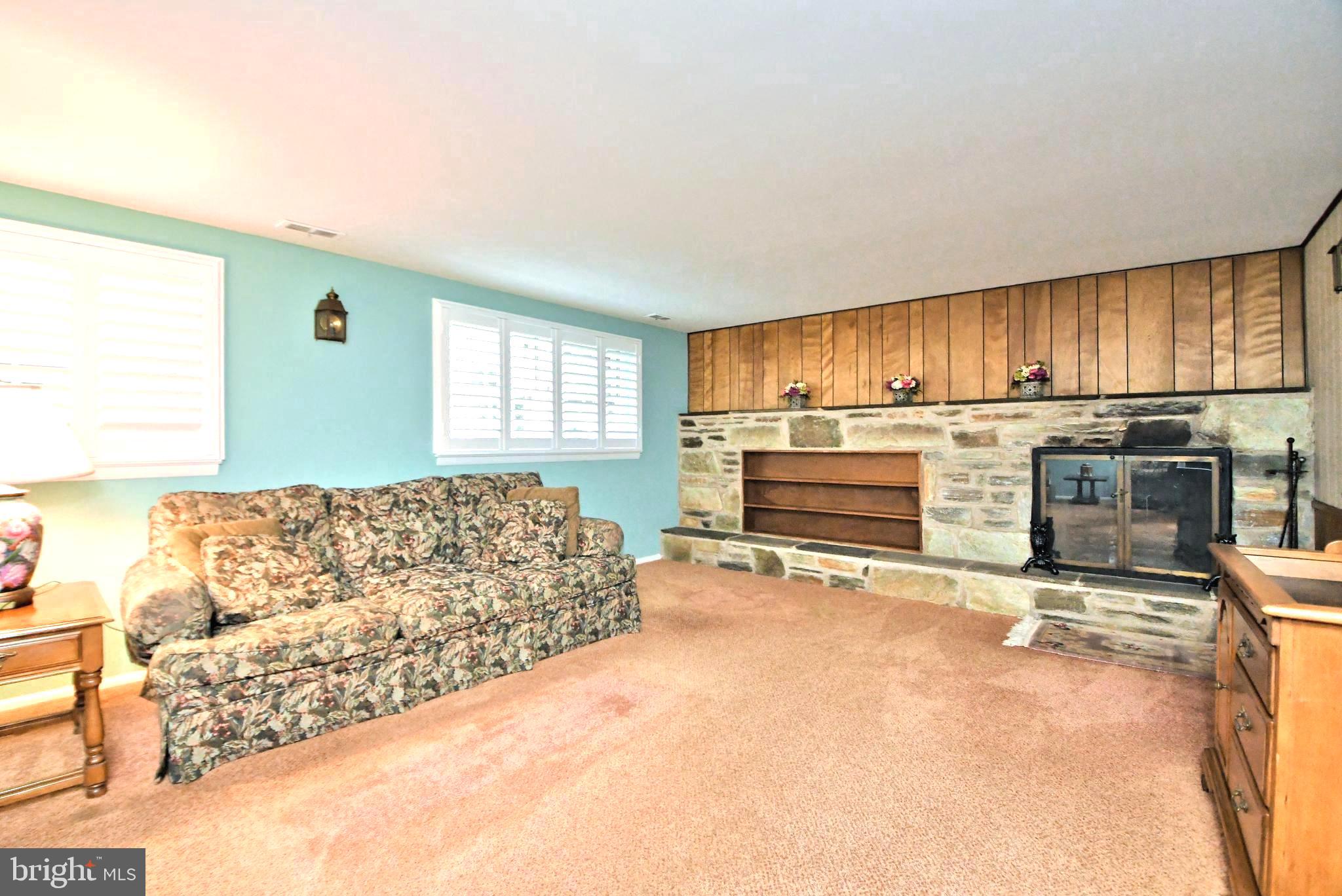 1669 Kenmare Drive Dresher, PA 19025 - Photo 21 of 29 Family room w/stone fireplace; plantation shutters