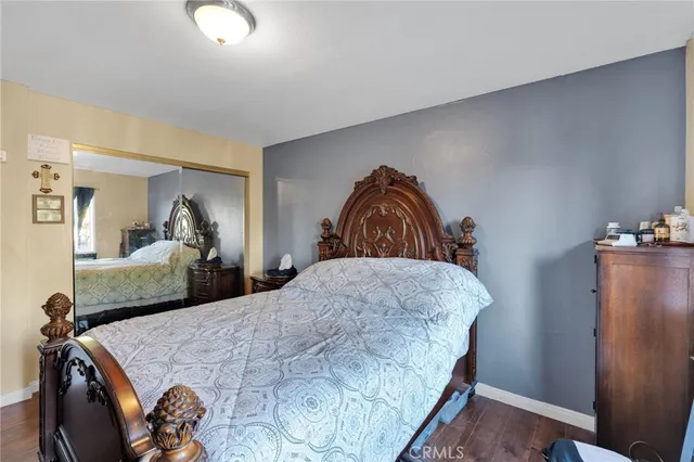 a bedroom with two beds and a dresser