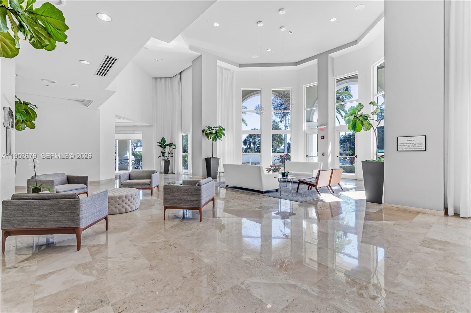 99 Southeast Mizner Boulevard, Unit PH16 Boca Raton, FL 33432 - Photo 17 of 30 a living room with furniture and a large window