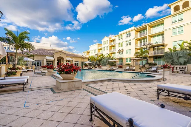 a view of swimming pool with outdoor seating