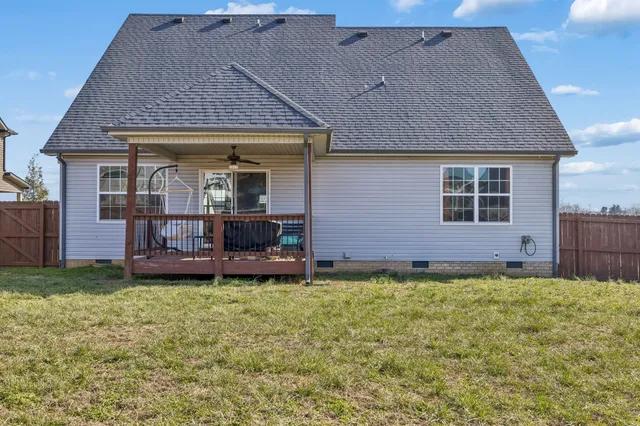 a front view of a house with a garden and plants