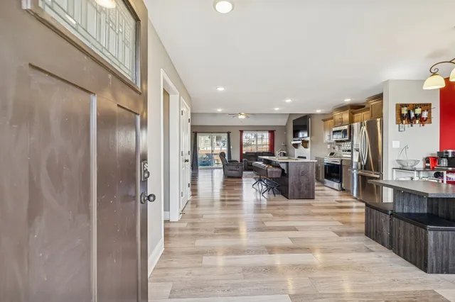 a lobby with furniture and wooden floor