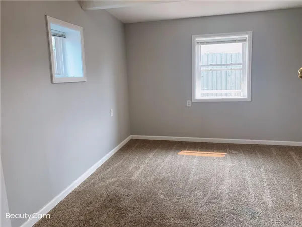 a bathroom with a bathtub and window