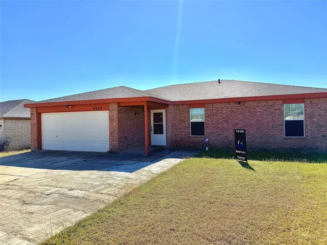 a front view of a house with yard