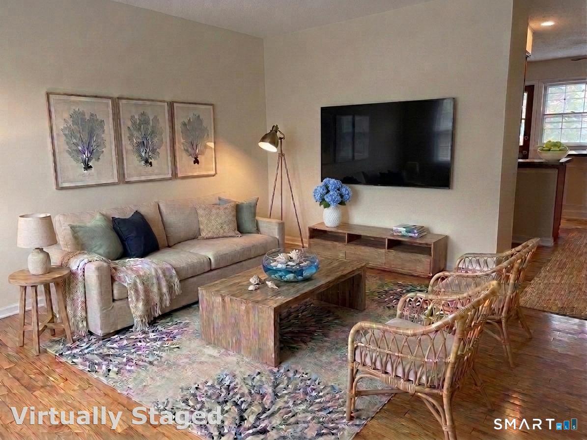 116 Commerce Street, Unit 5 Clinton, CT 06413 - Photo 4 of 18 a living room with furniture and a flat screen tv