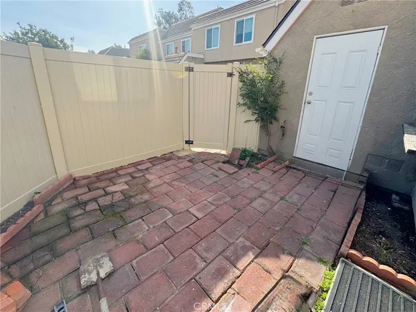 a view of a backyard of the house