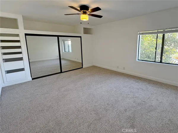 a view of empty room with windows